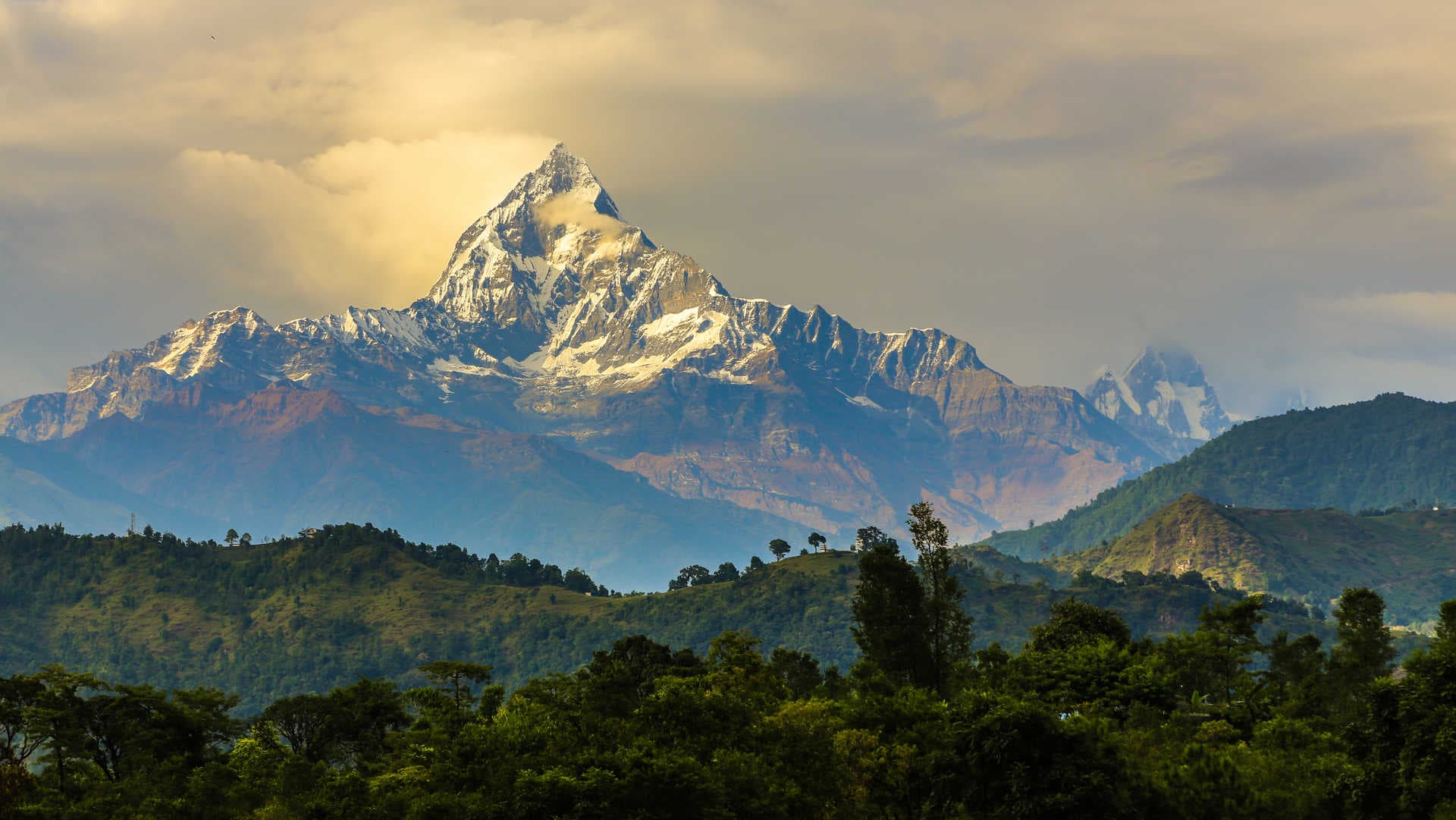 Machhapuchhre peak above the hills of Pokhara at golden hour
